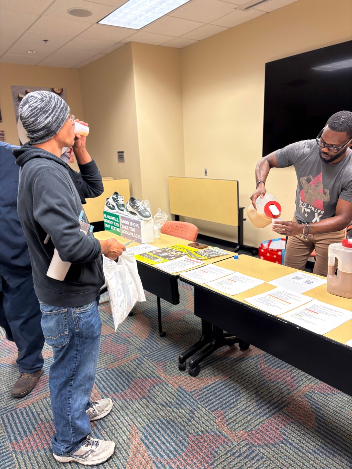Steve Miller pouring Signature Series samples at a community wellness event