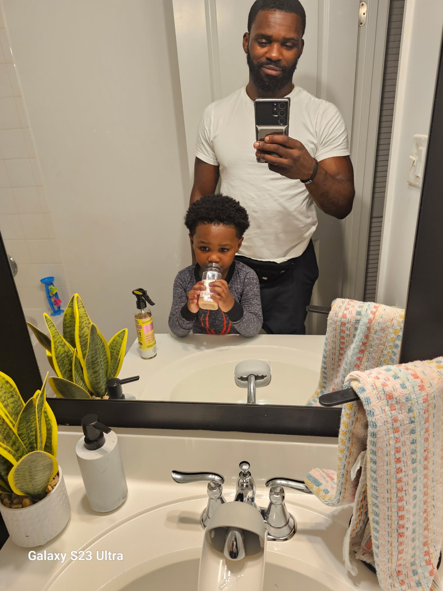Father and son sharing a Signature Series shake at home