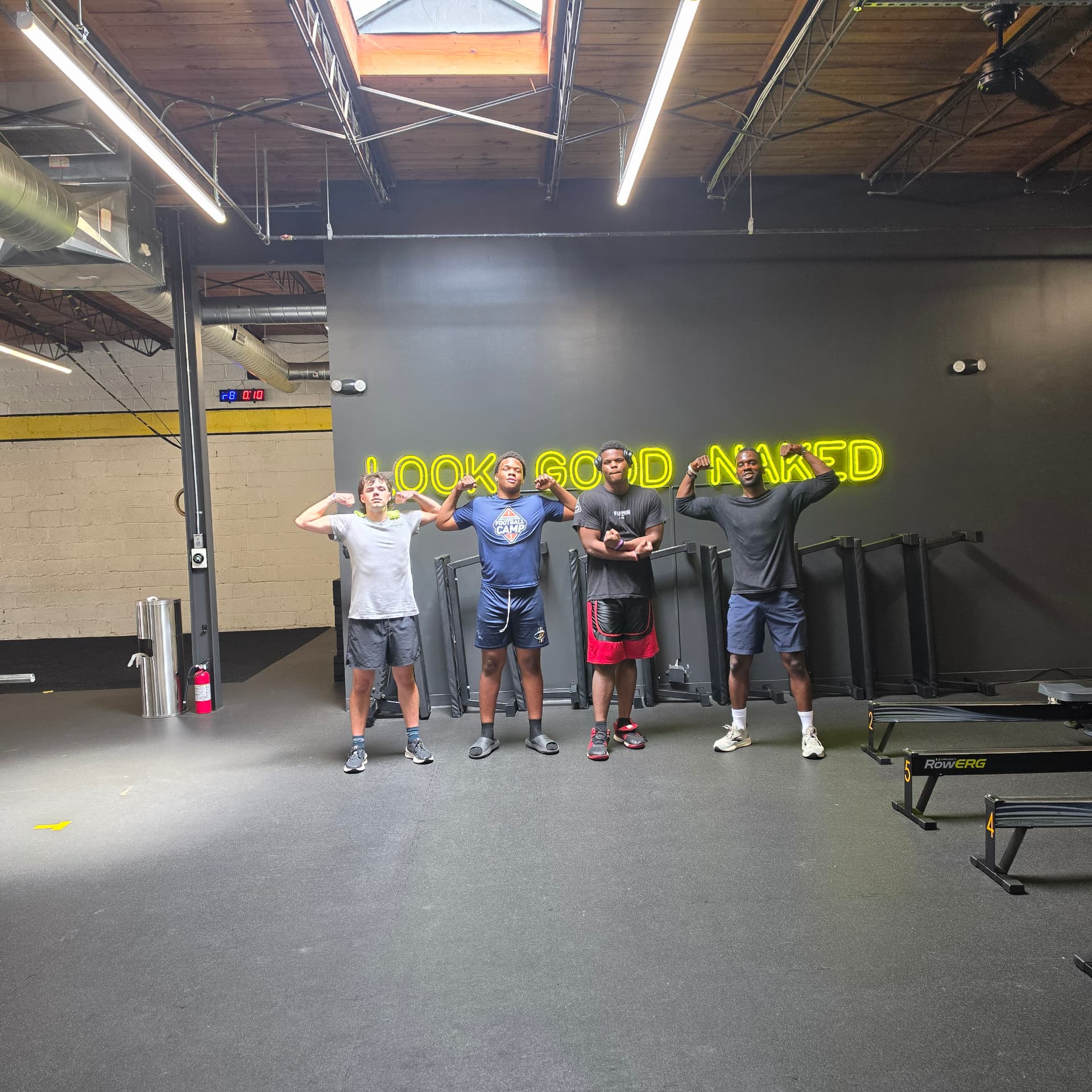 Teen athletes flexing after a strength and speed session