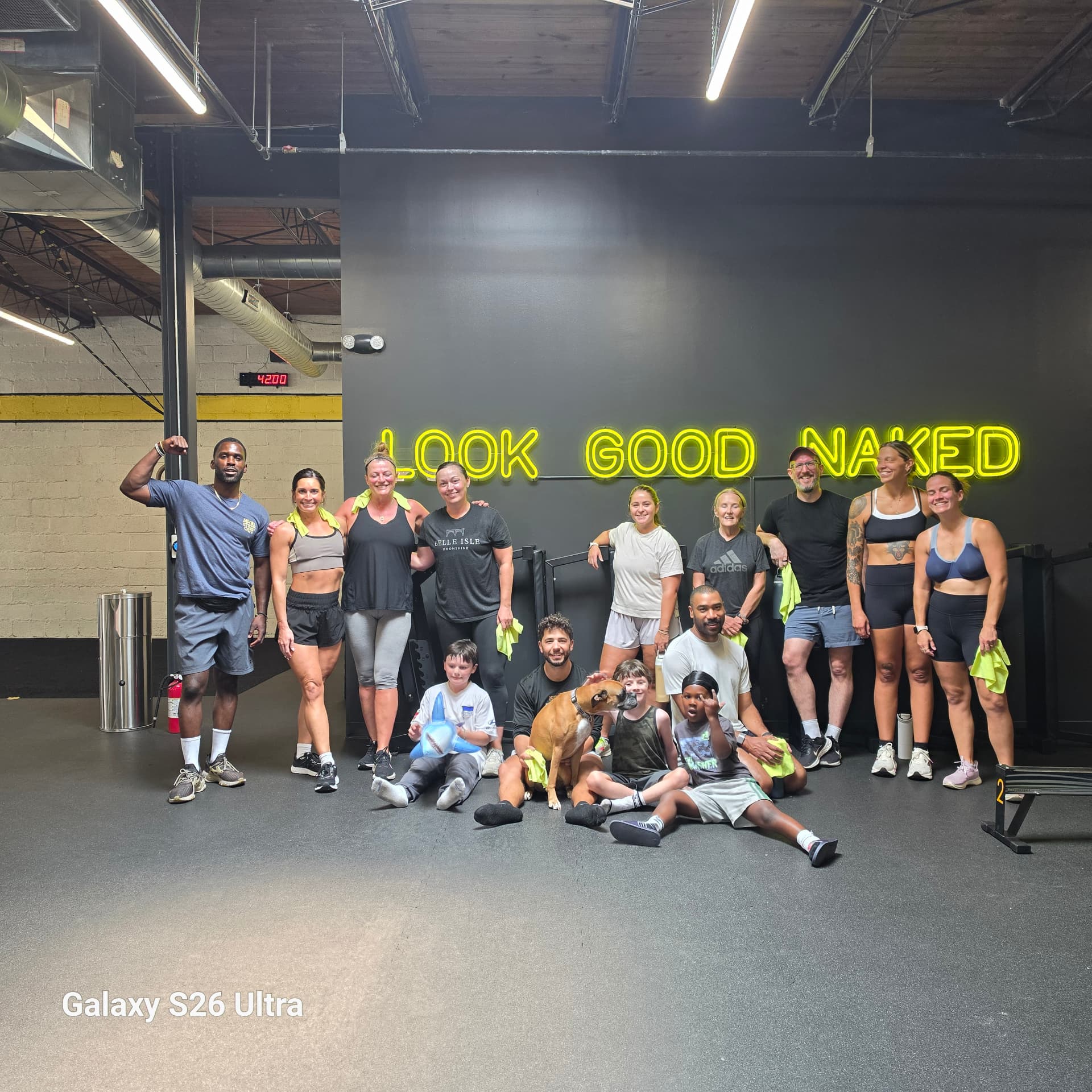 SMFit X members and coaches gathered after a community workout